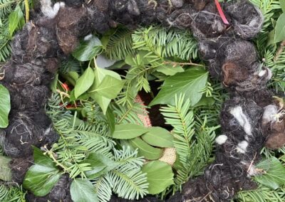 Wool Shred behind wreaths by Margot Lemons' Garden
