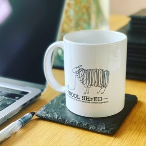 Wool Shred Mug on a coaster