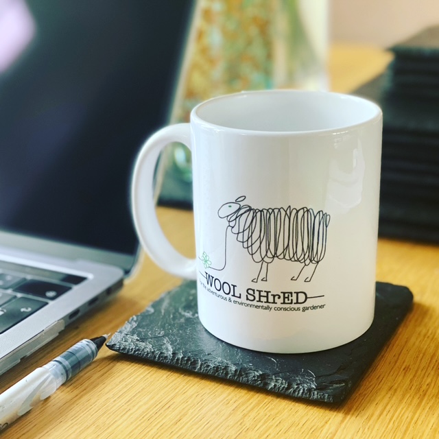 Wool Shred Mug on a coaster