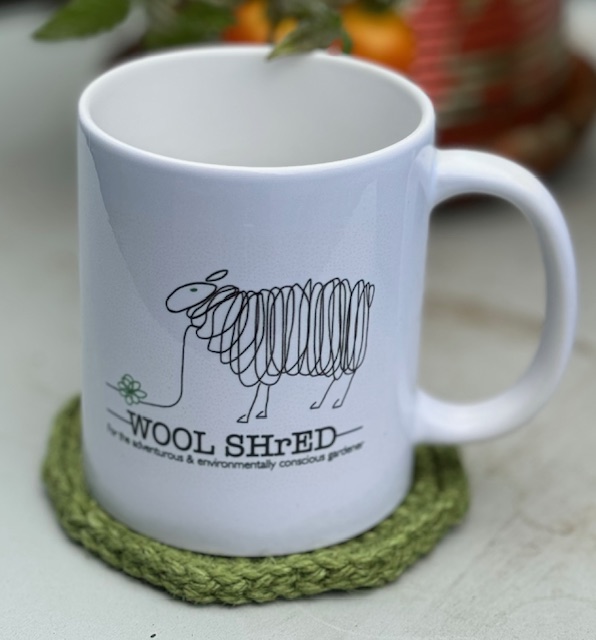 Wool Shred Mug on a coaster