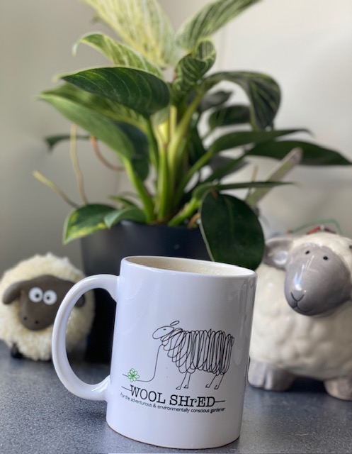 Wool Shred Mug on a coaster